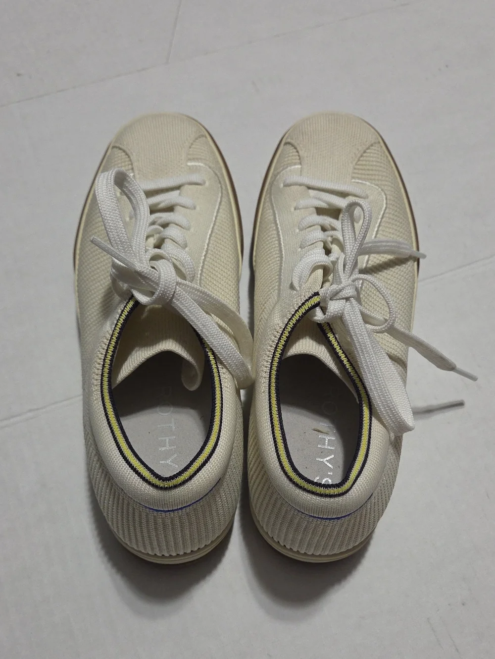 Rothy's Cream Knit Lace-Up Sneakers with Yellow and Black Collar Trim